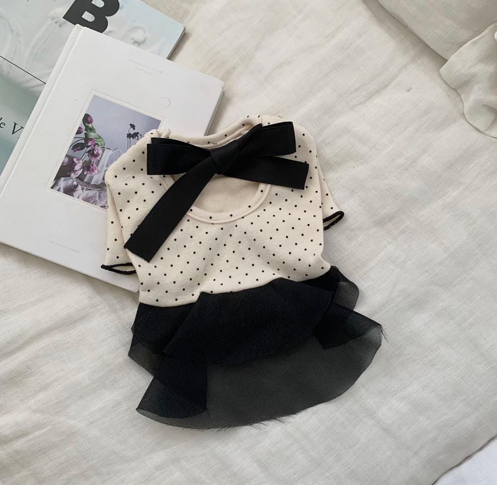 NKpup beige dog dress with black polka dots, a black bow, and a black mesh ruffle skirt