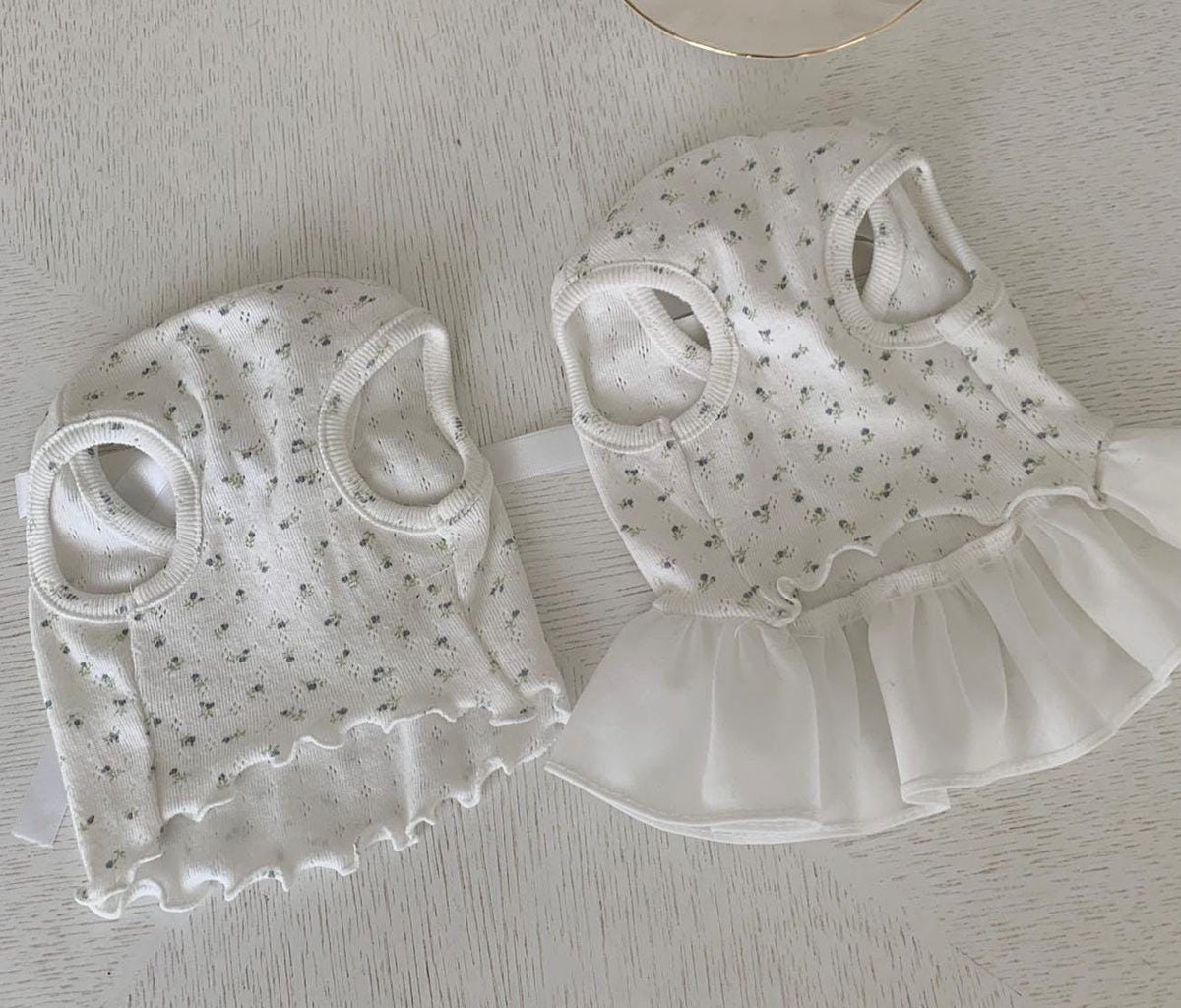 NKpup Tiny Flower Ribbon dog dress and shirt in white with a delicate floral pattern.