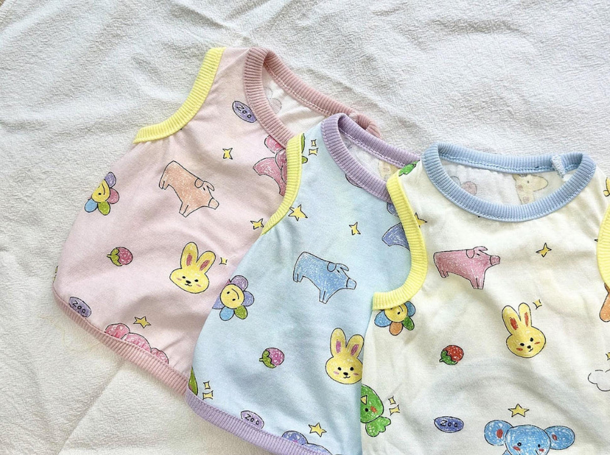 ZOO Friends NKpup dog shirts in pink, blue, and white with animal and star patterns.