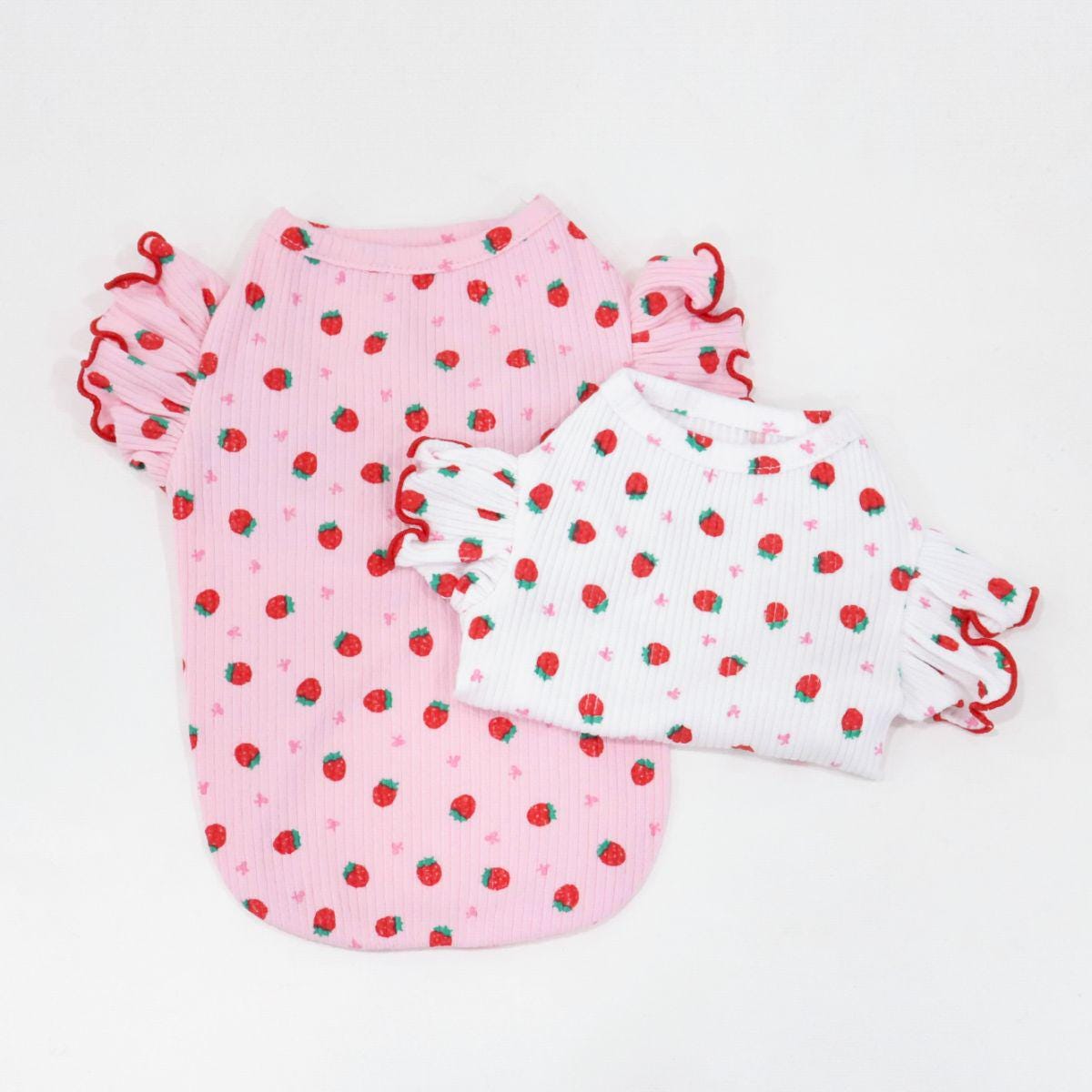 NKpup Strawberry Frill Top pet shirts in pink and white with strawberry patterns and ruffled sleeves.