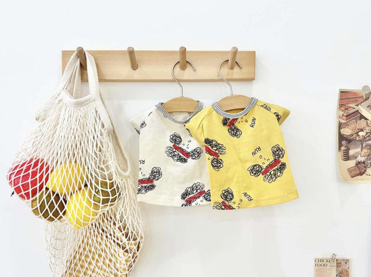 NKpup Run Sketch Tee dog shirts in white and yellow with a doodle print