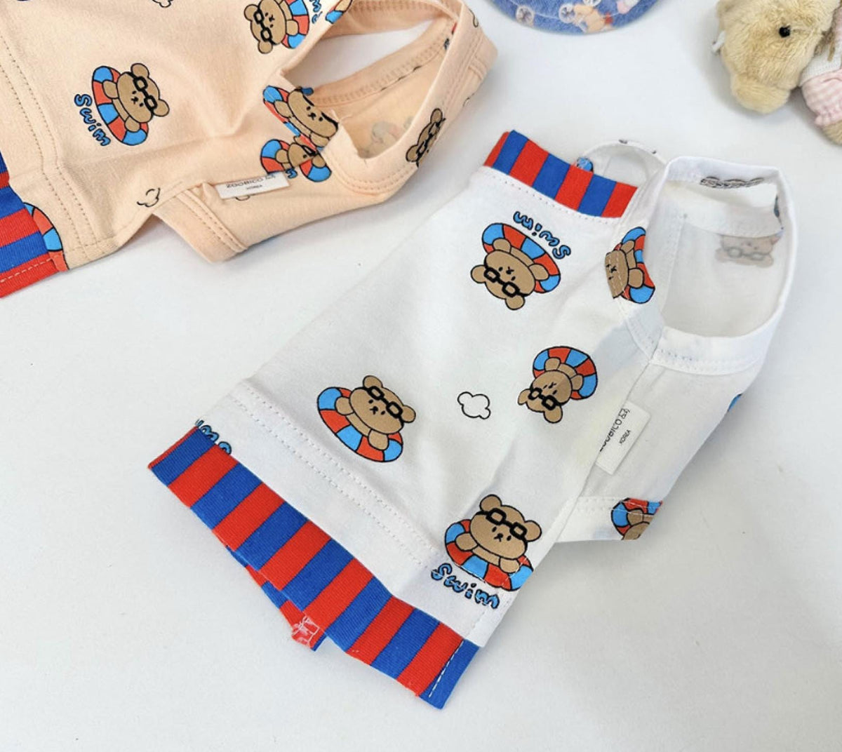 NKpup Teddy Float Top white dog shirt with teddy bear floatie pattern and red and blue stripes