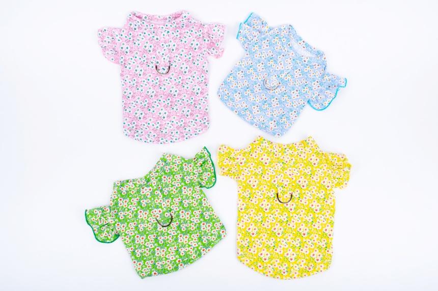 Set of four floral print dog crop shirts in pink, blue, green, and yellow with D-ring details by NKpup