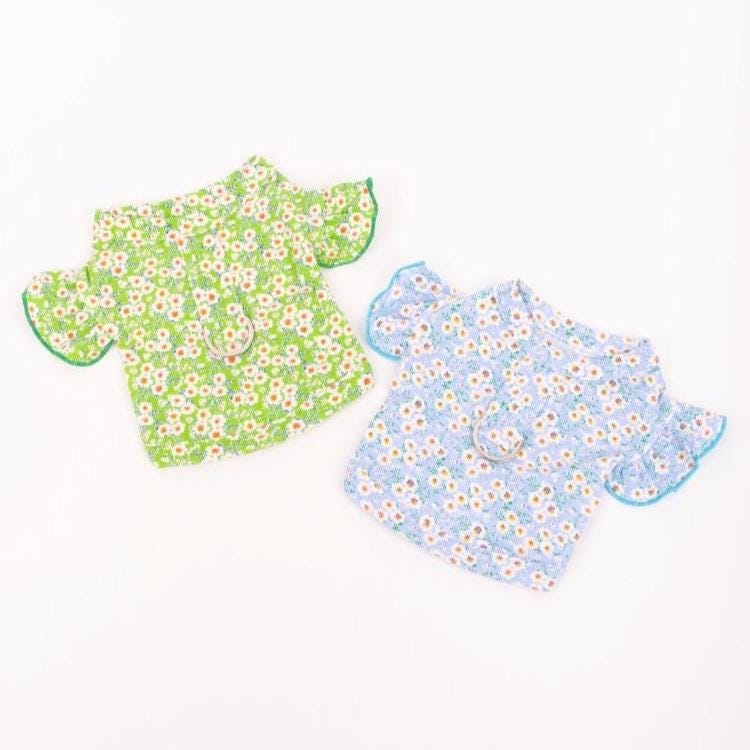 Two NKpup floral D-ring dog crop shirts in green and blue patterns.