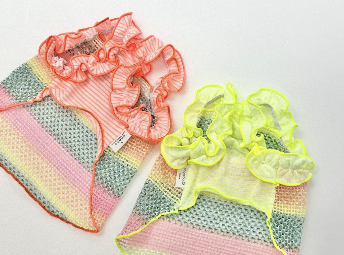 Two NKpup Rainbow Ruffle Mesh dog tops in coral and neon yellow with striped patterns.