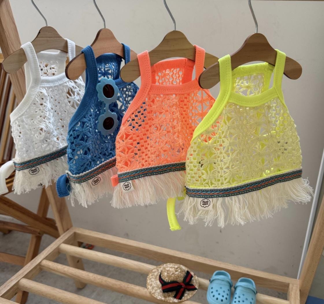 Daisy Crochet Dog Tank Top in white, blue, orange, and yellow with fringe detail.