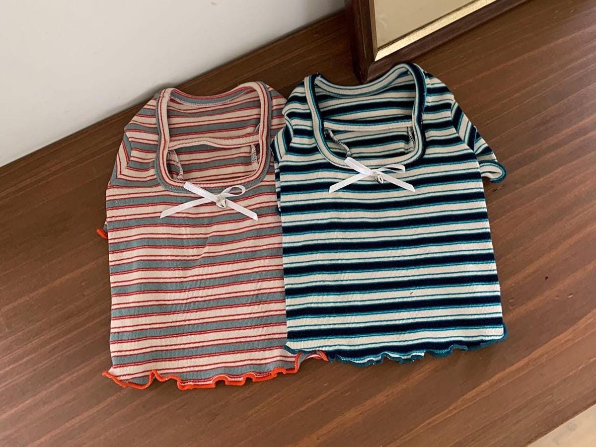 NKpup Sailor Stripe dog tops in peach and navy blue striped patterns.