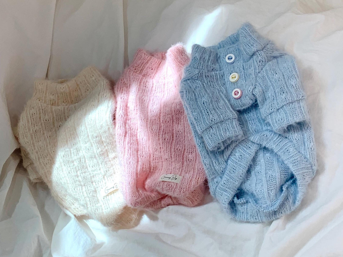Jelly Button Knit Dog Sweaters in cream, pink, and light blue