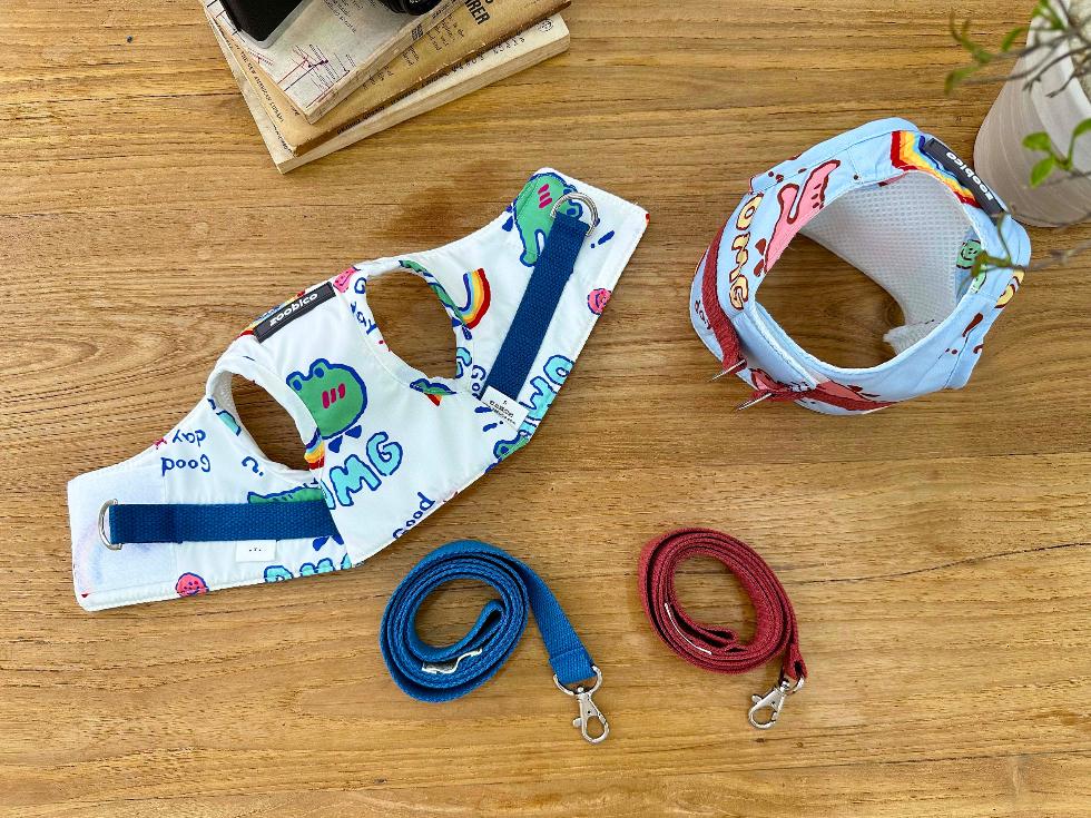 NKpup cartoon print dog harness and matching leash set in blue and red.