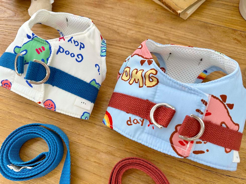NKpup cartoon print pet harness and leash set in white and light blue patterns.