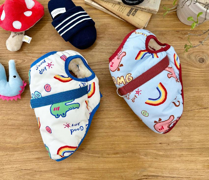 NKpup OMG D-Ring Padded Dog Vest in white with green dinosaur print and light blue with rainbow pattern.