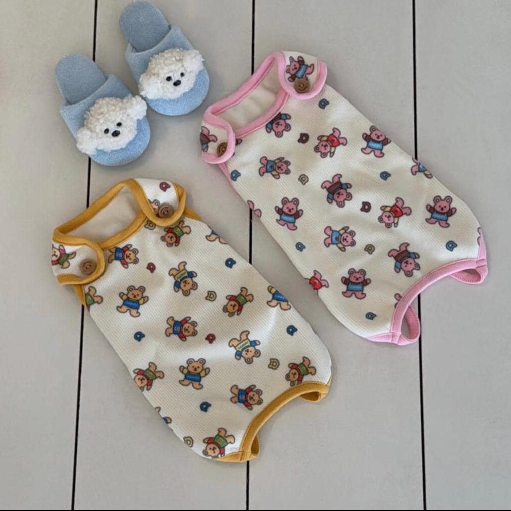 Berry Bear pet outfit overalls in cream with bear patterns and pink or yellow trim.