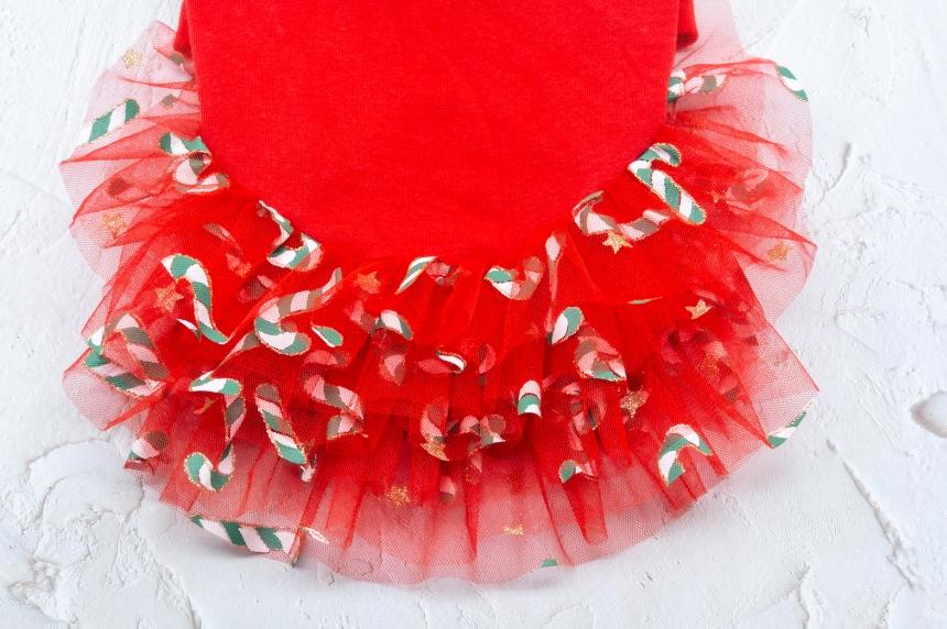 Red Christmas dog dress with a candy cane patterned tulle tutu skirt.