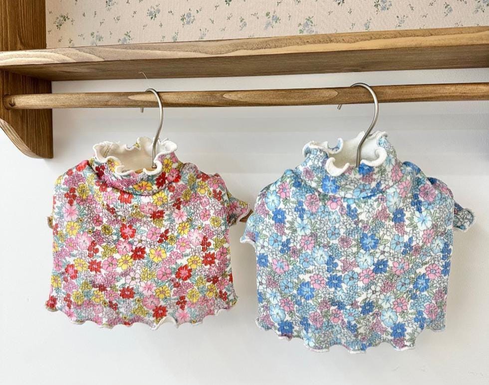 NKpup Floral Garden Crop Tees for dogs in red and blue floral patterns with ruffled collars.