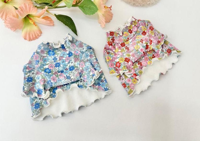 NKpup Floral Garden Crop Tees in blue and pink floral patterns with ruffled edges.