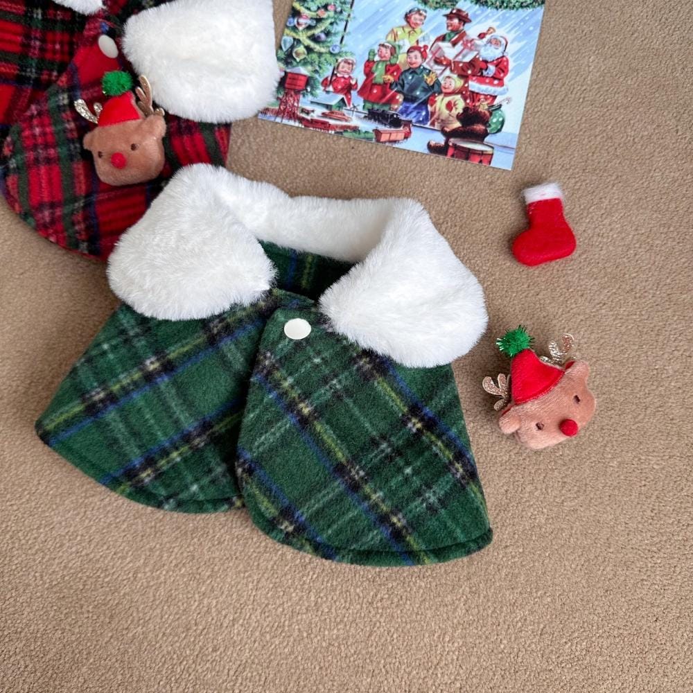 Green plaid Christmas reindeer dog cape with a white faux fur collar and button closure.