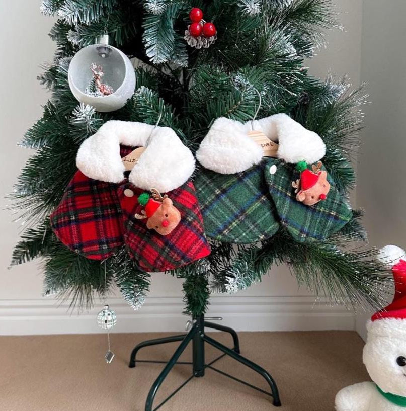 Red and green plaid Christmas reindeer dog capes with white faux fur trim.