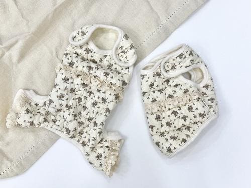 NKpup cozy floral dog vest and matching overall in white with a delicate flower pattern