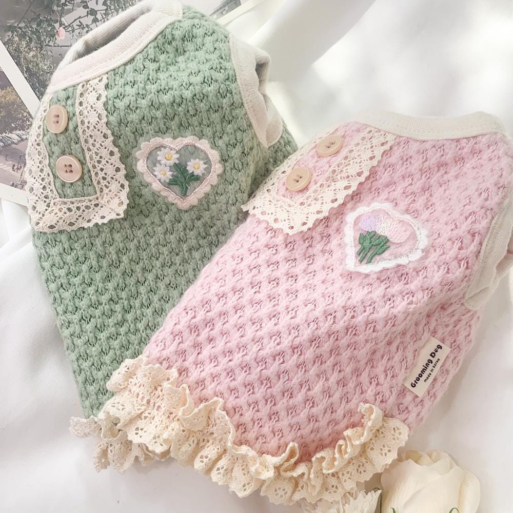 Garden Knit Dog Vest in sage green and soft pink with heart floral patches and lace trim.
