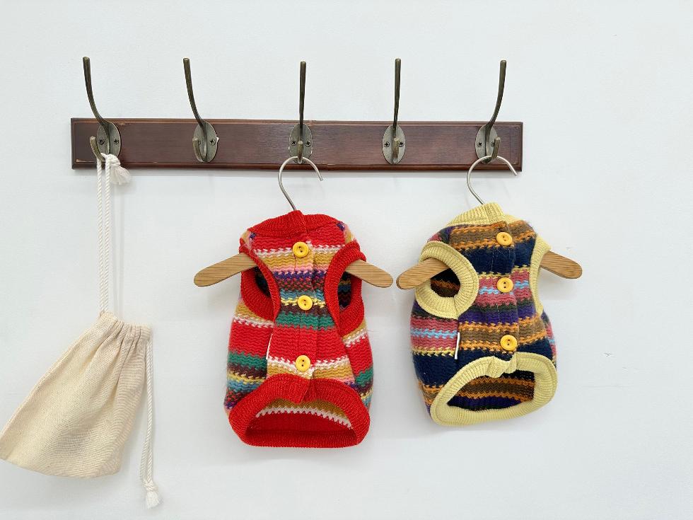 NKpup Bene Zigzag Knit Dog Vests in red and yellow multi-colored striped patterns with buttons.