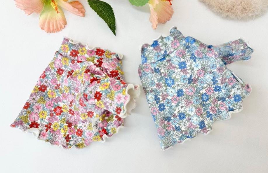 NKpup Floral Garden Crop Tees for dogs in red and blue floral patterns with scalloped edges.