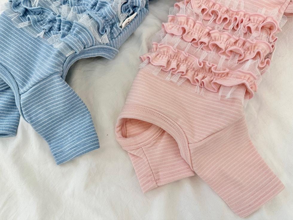 Blue and pink NKpup ruffle ribbed dog overalls with mesh trim.