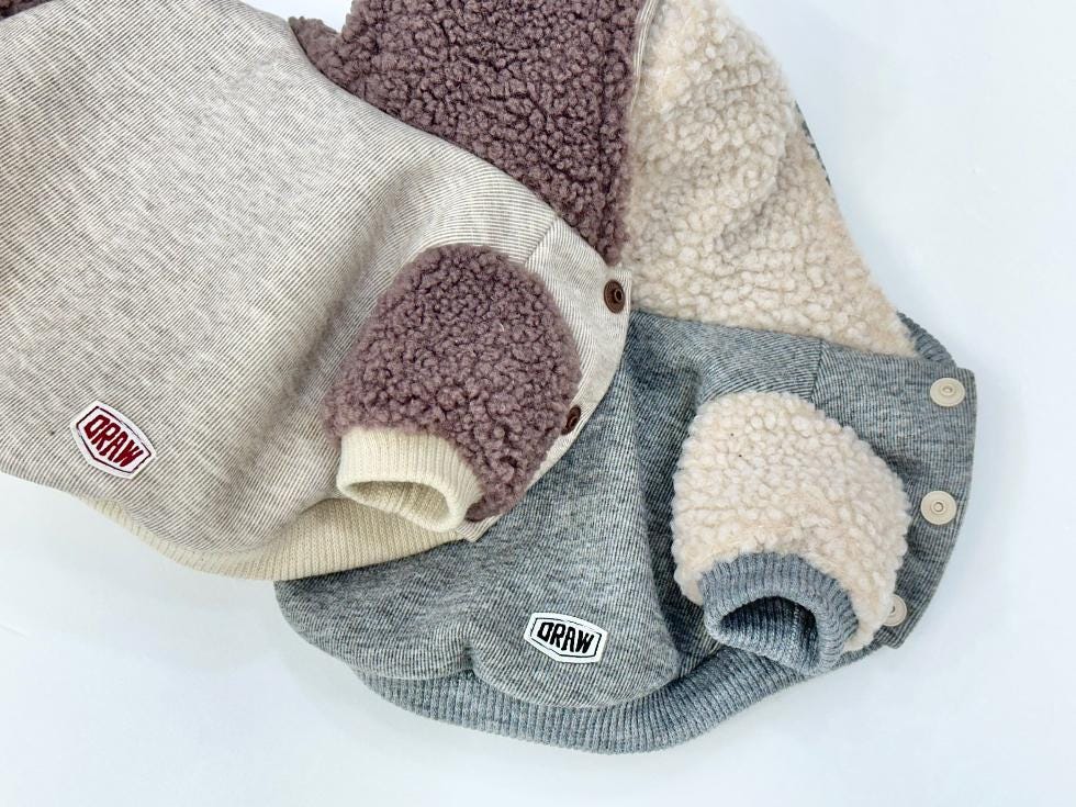 NKpup Draw Sherpa dog hoodie jackets in grey, beige, and mauve with fuzzy fleece details.