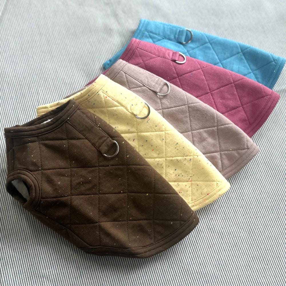 NKpup Quilted D-Ring Dog Vests in brown, cream, grey, purple, and blue.