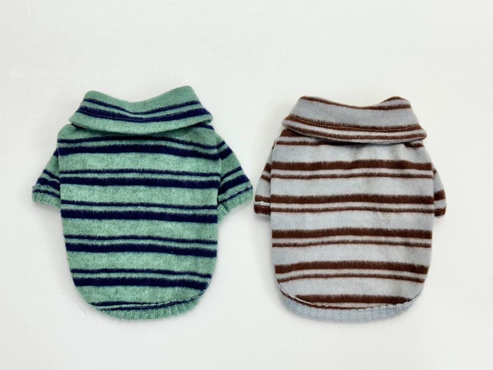 Striped fleece dog polo shirts in mint green and light grey with brown stripes.