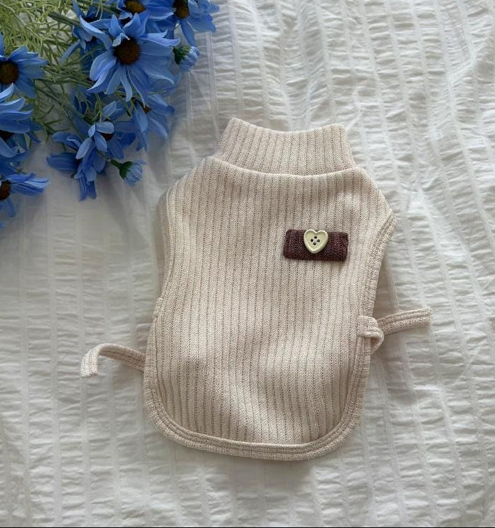 Cream ribbed dog turtleneck vest with a small heart detail