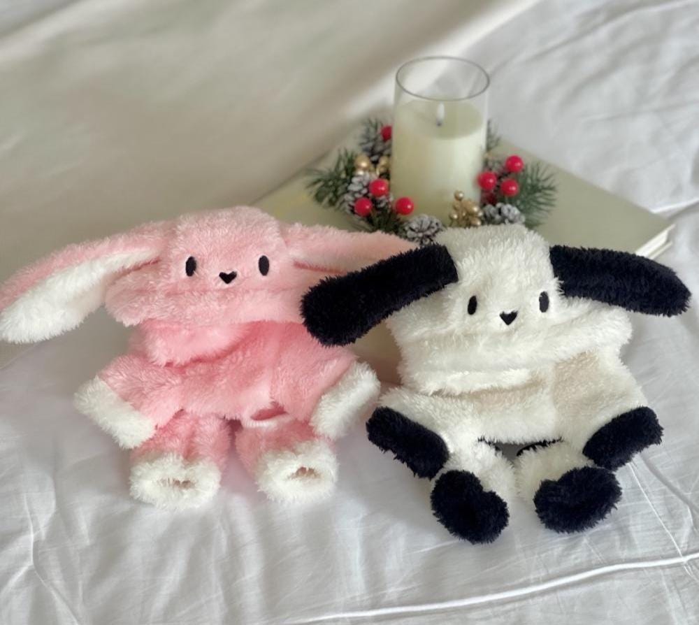Pink and white bunny fleece overalls for pets with long floppy ears.