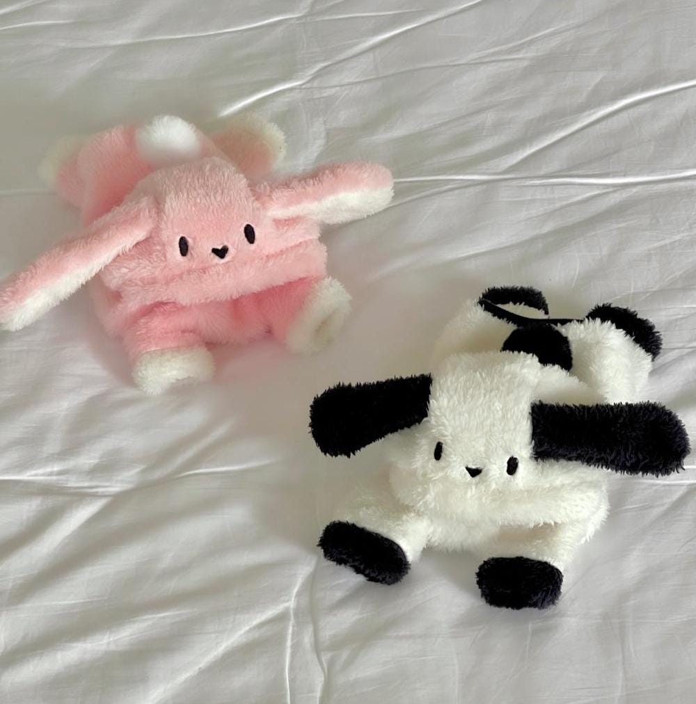 NKpup Bunny Fleece Overalls in pink and white with long bunny ears.
