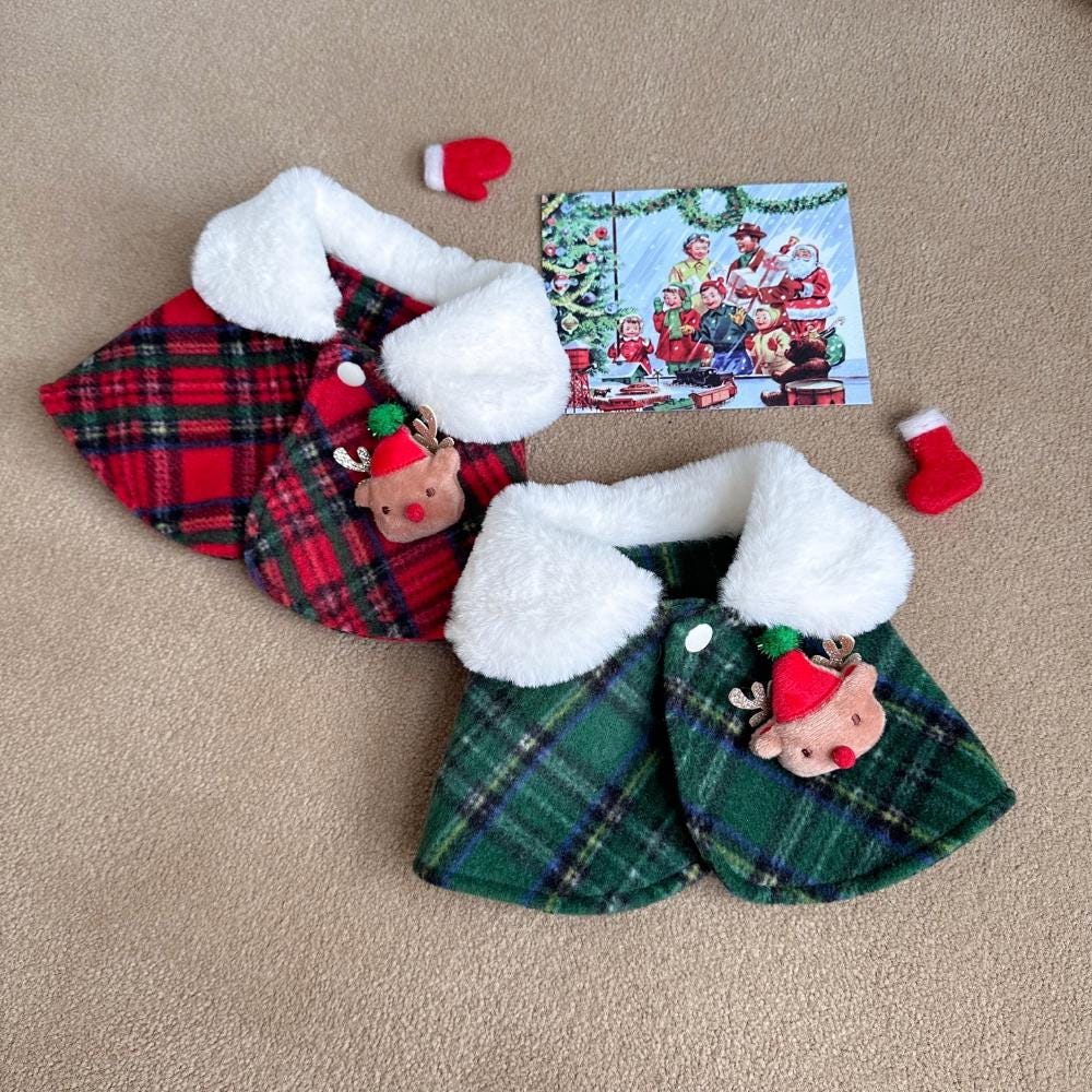 Red and green plaid Christmas reindeer dog capes with white faux fur trim and reindeer ornaments.