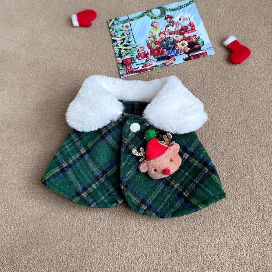 Green plaid Christmas reindeer dog cape with white faux fur collar and reindeer applique.