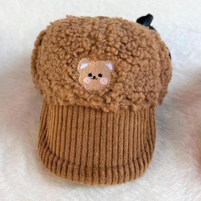 Brown teddy fleece cap with a cute bear patch and corduroy brim