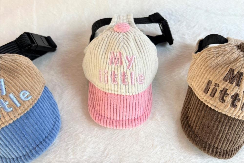 Three NKpup My Little Corduroy Caps for dogs in blue, pink, and brown colors