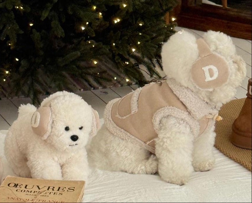 NKpup Cozy Pocket Shearling Vest in beige with a decorative pocket and matching head accessory.