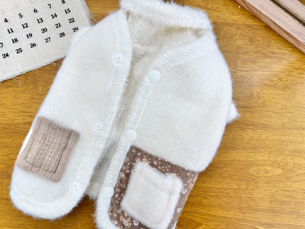 NKpup white angora fleece dog vest with brown patterned patches and button closures