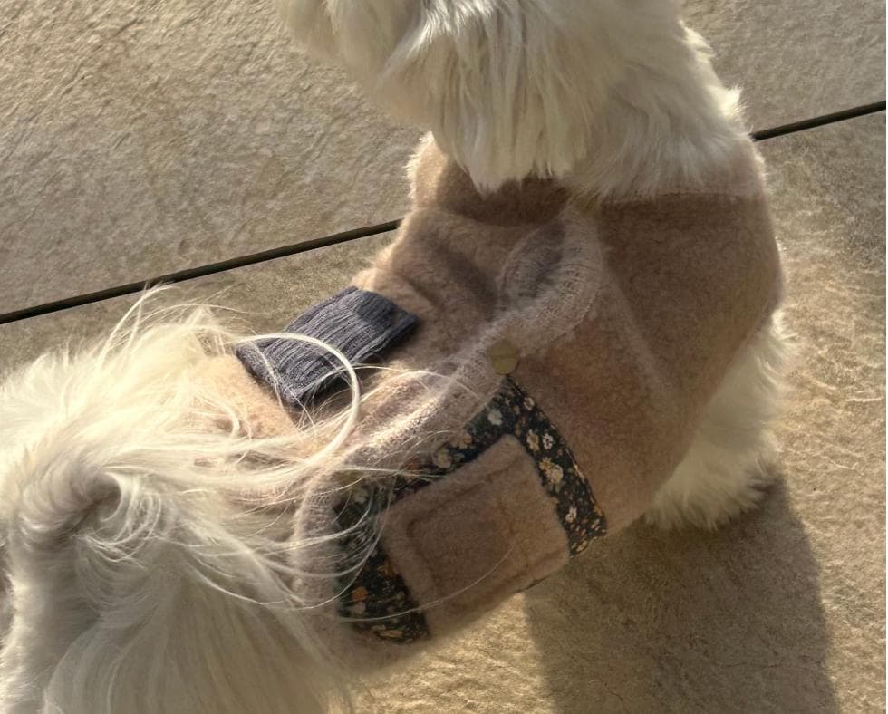 NKpup beige Angora fleece dog vest with floral trim and a small button detail