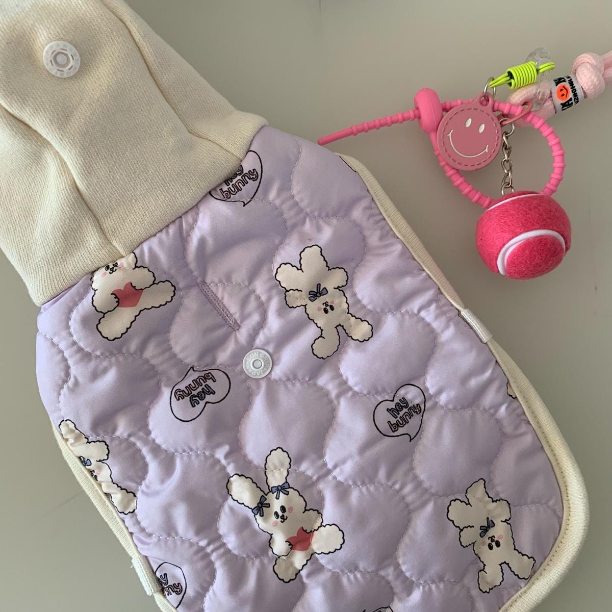 NKpup purple quilted dog vest featuring cute bunny patterns and a cream collar.