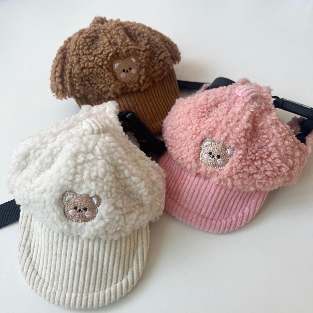 NKpup Teddy Fleece Caps in brown, pink, and cream with cute bear embroidery