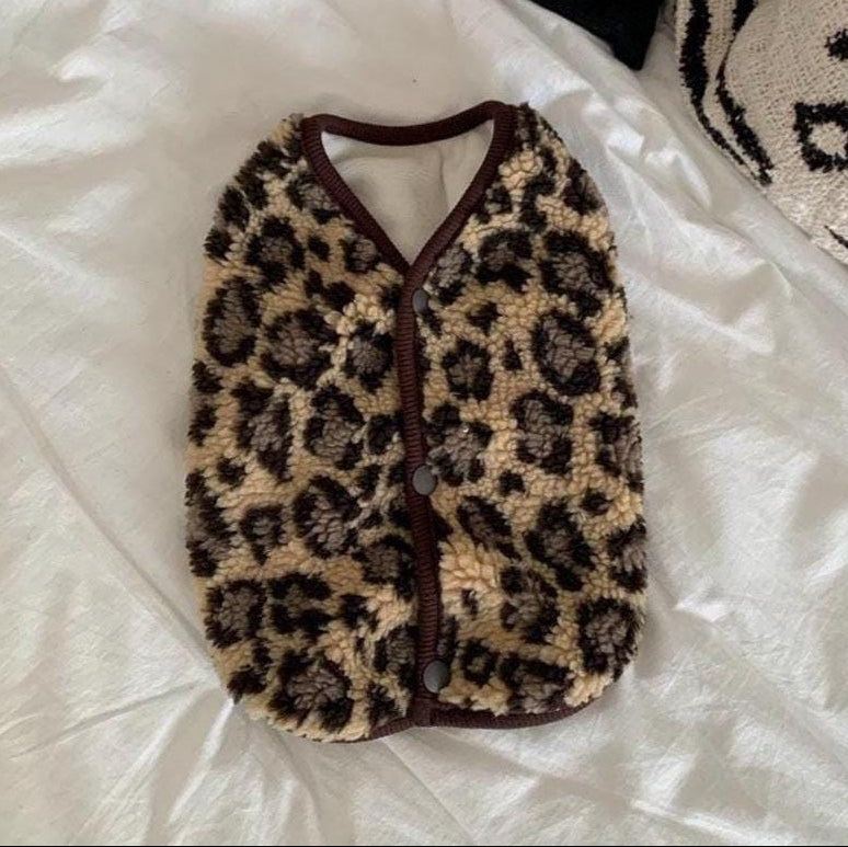 Leopard print fleece dog vest with brown trim and button closure