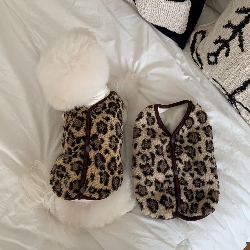 Leopard print fleece dog vest in brown and beige with button closures.