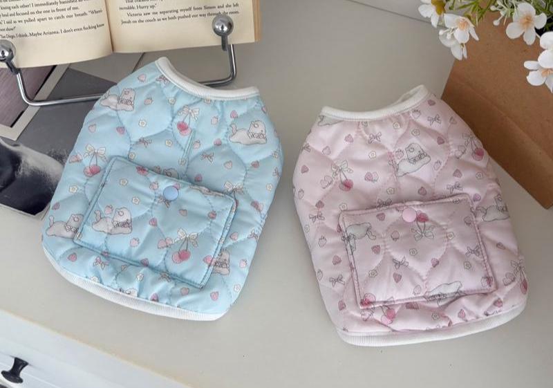 Two Bunny Pocket Padded Dog Vests in light blue and pink with bunny and cherry patterns.