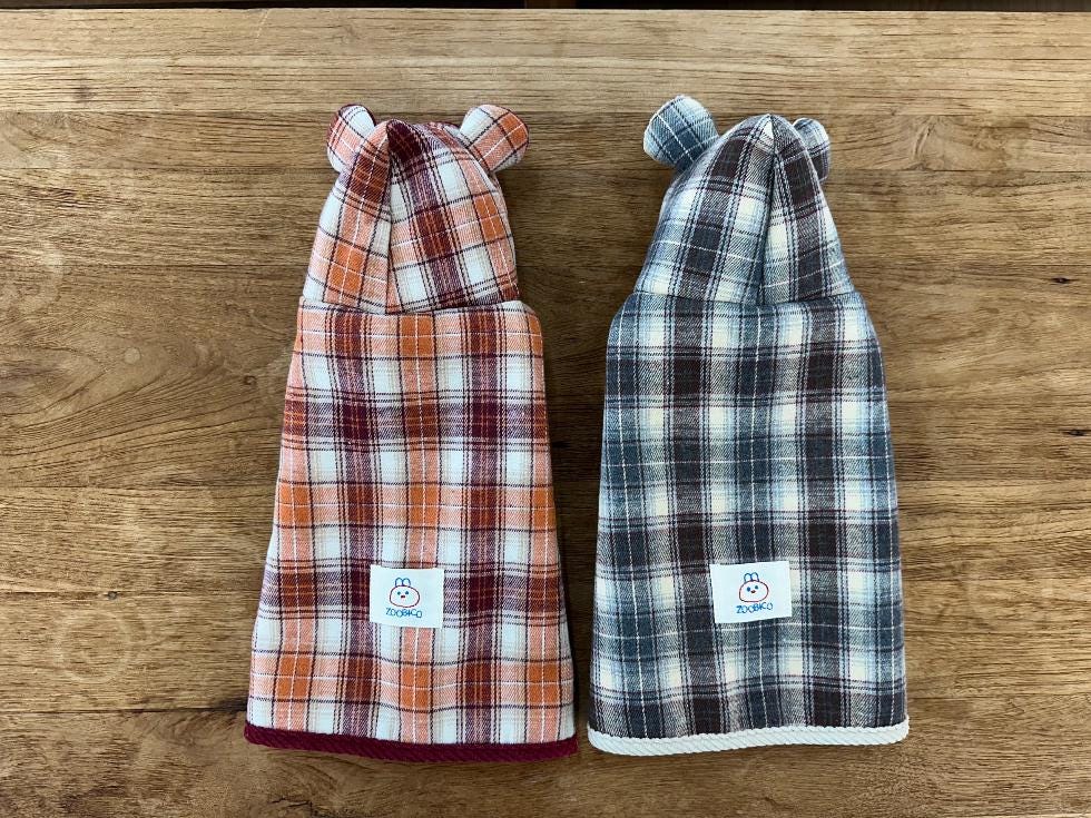 NKpup plaid cape dog vests in orange and blue checkered patterns