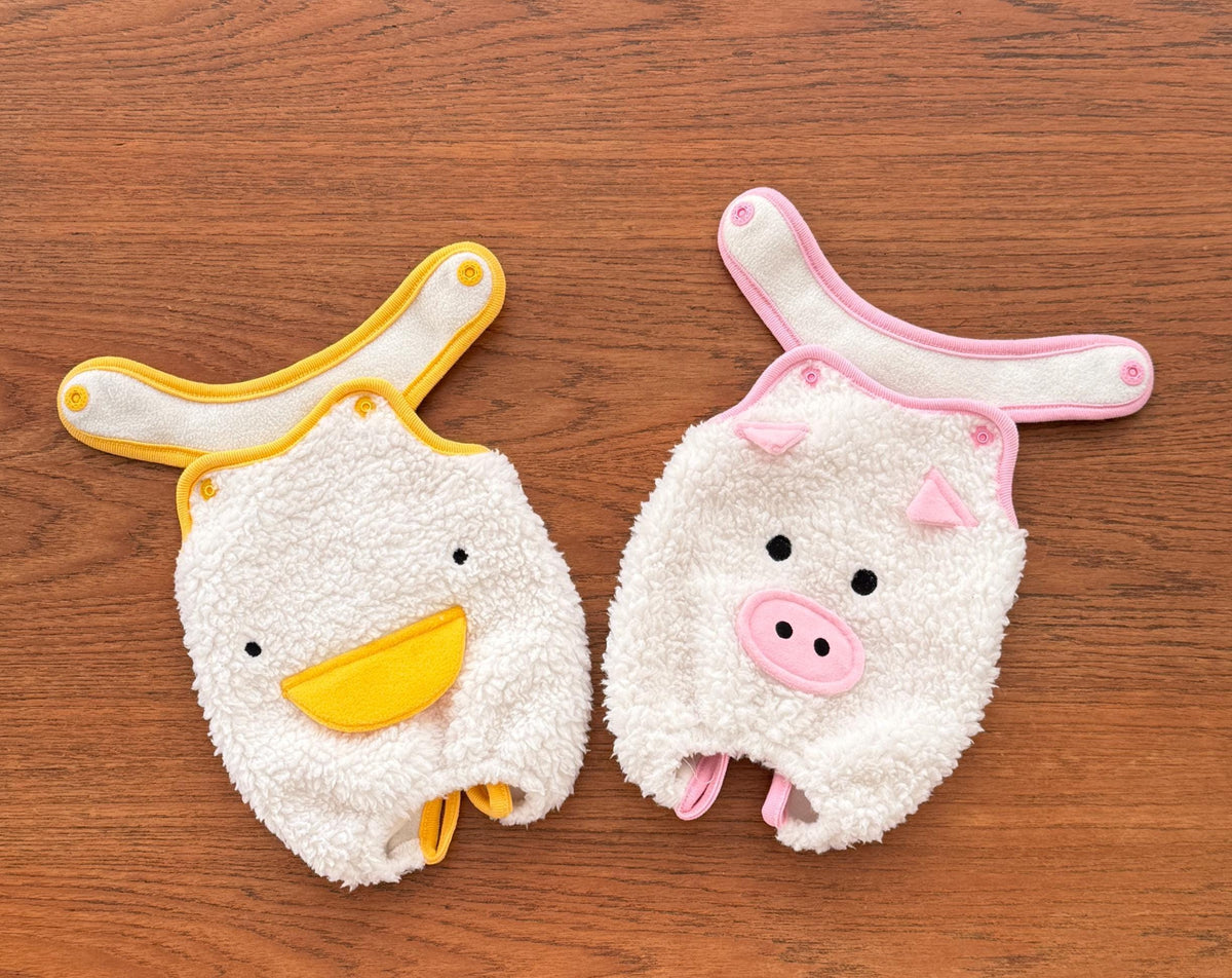 NKpup plush fleece dog overalls in white duck and pig designs with colorful trim