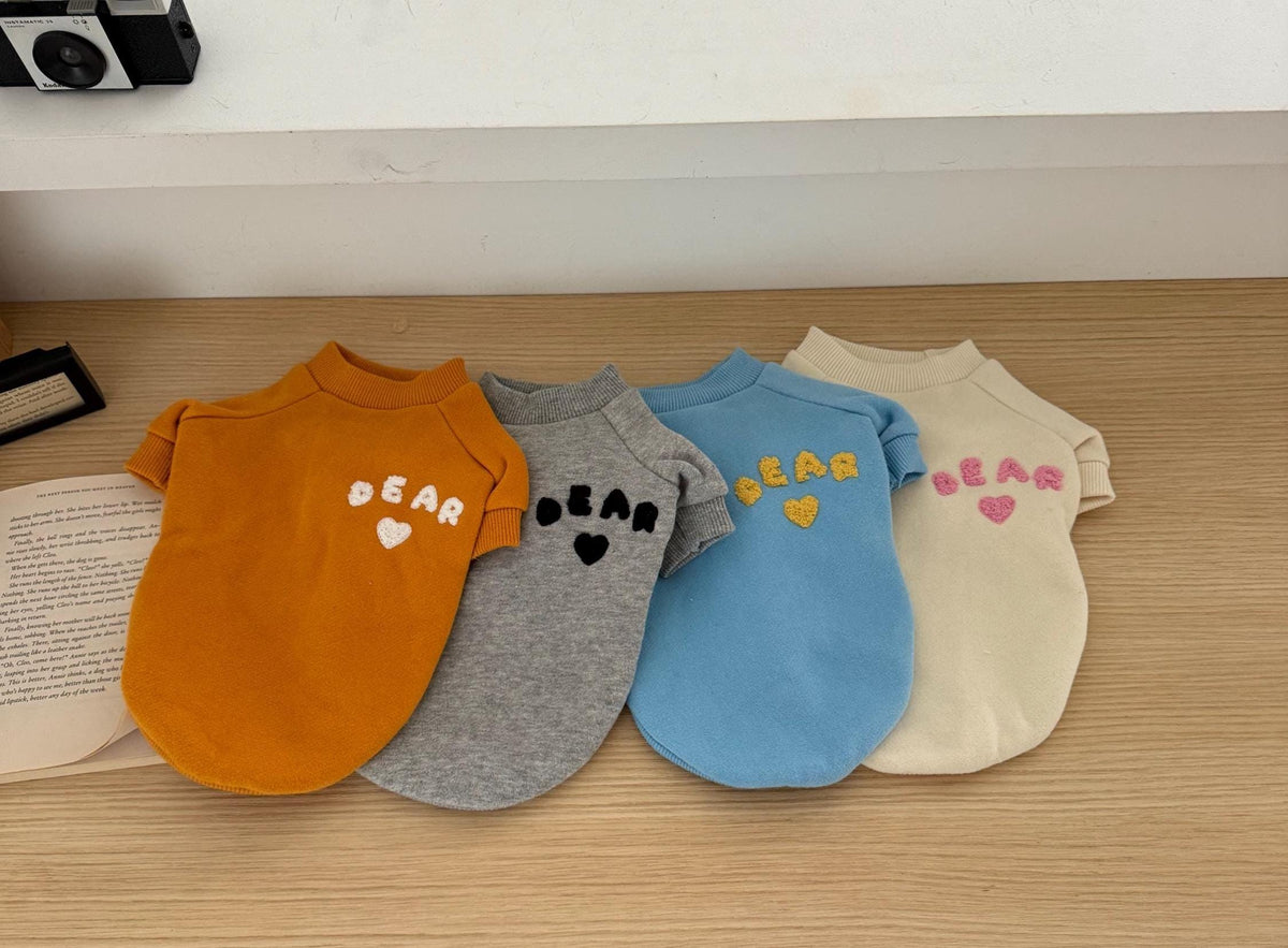 Bear Heart Fleece Dog Sweatshirts in mustard, grey, blue, and cream colors.