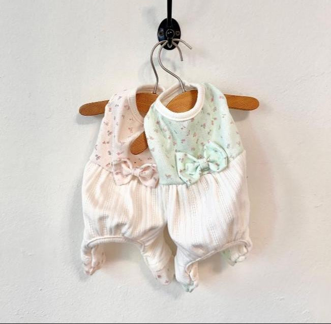 Two NKpup Mini Garden Dog Overalls in pink and mint floral patterns with bow accents.