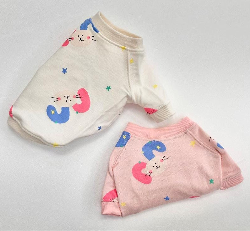 NKpup Star Bunny Cozy Sweatshirts in white and pink with colorful bunny and star patterns.