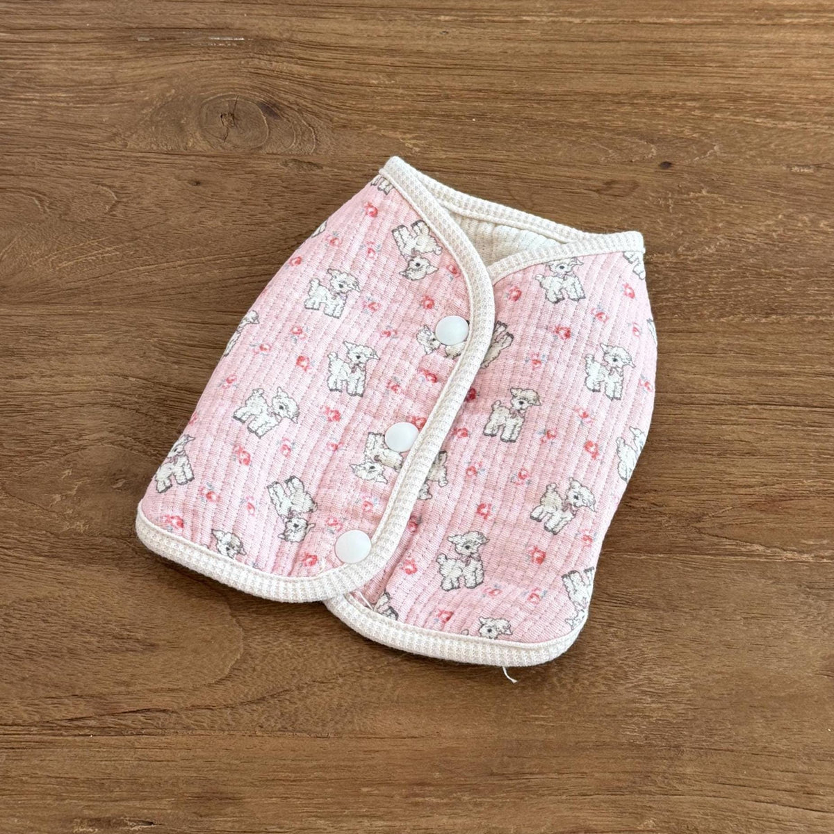NKpup Pony&Lamb dog vest in pink with a lamb pattern and white button closures